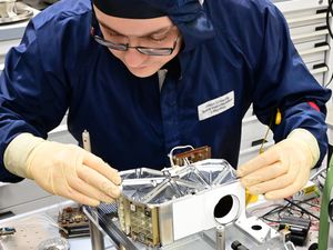 Dr Rory Evans performing optical assembly and alignment on a component of the Lunar Trailblazer spacecraft