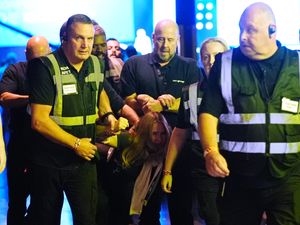 Supporting image for story: Climate protesters removed from Reform conference after heckling Nigel Farage