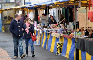 Shoppers browse the market stalls in Dudley's High Street