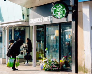 Flowers and tributes left at the scene outside Starbucks