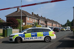 Police at the scene of the house fire in  Placomb Road Wolverhampton on June 25