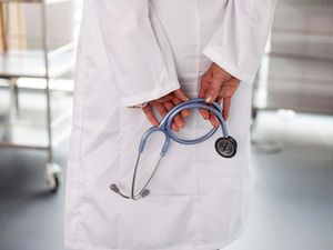 A female doctor holding a stethoscope