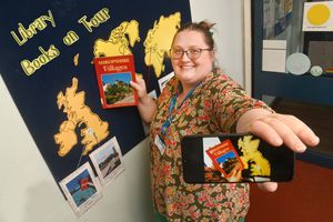 NORTH COPYRIGHT NATIONAL WORLD PLC STEVE LEATH 27/06/24..Pic at Market Drayton Library of Librarian: Catherine Westwood. They have a new summer initiative: Library Books on Tour. They want to see where there library books have travelled this summer, and when people send a photo in they add it to there map..