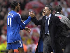 Didier Drogba shakes hands with Jose Mourinho during the pair's time at Chelsea