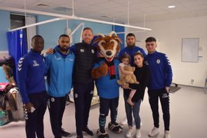 Daniel Udoh, Matthew Barnes-Homer, Gavin Cowan, Bobby the Buck and other players with Ava Conroy