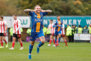 Jason Cummings celebrates after making it 1-0