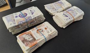 Thousands of pounds were seized as part of the raids. Photo: West Midlands Police