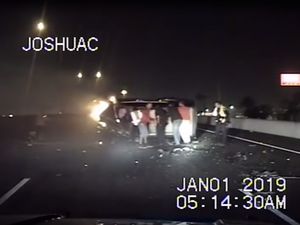 Supporting image for story: Police dashcam captures good Samaritans flipping burning car back onto its wheels