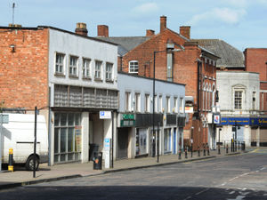 Supporting image for story: Asbestos found in shops to be flattened