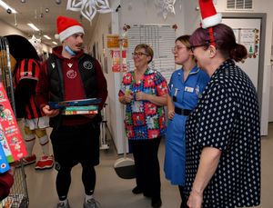 Walsall FC players visit Walsall Manor Hospital.Jamie Jellis with staff.