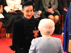 Supporting image for story: A towering success: Brownhills model Erin O'Connor gets her MBE from the Queen