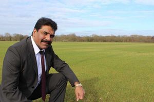 Councillor Mattu inspects the new pitches at Barnhurst Lane which are currently taking root.