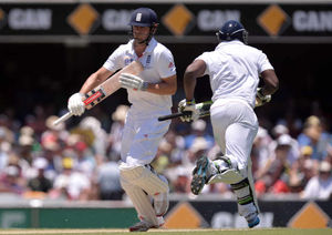 England's Alastair Cook (left) and Michael Carberry (right) run between the wickets