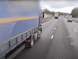 Supporting image for story: Video shows moment a lorry driver using their phone nearly hits police HGV