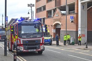Fire crews respond to the fire in the Beatties building