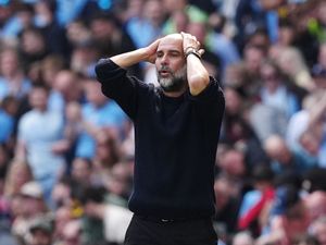 Manchester City manager Pep Guardiola gestures on the touchline