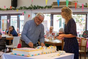 CEO Lisa Cowley hands out cake on the anniversary day. Photo: Natalie Bolton - NB photography