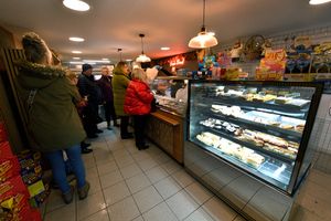 The shop is busy all day, with people queueing through the door