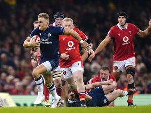 Scotland's Duhan van der Merwe breaks free of the Welsh defence