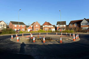 The entrance to the estate is covered in fresh tarmac as the roadworks come to an end