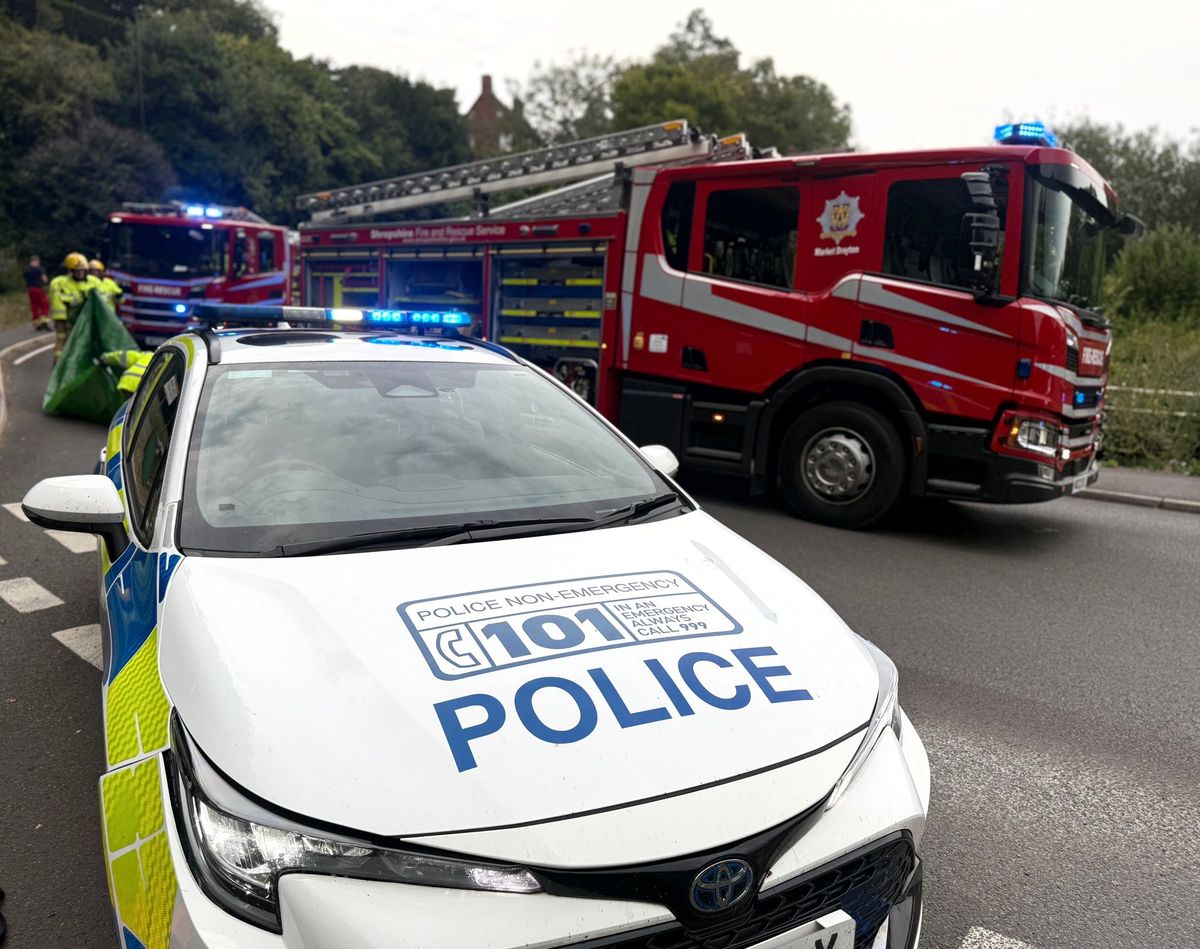 Elderly man cut free and rushed to hospital with head injury after car flips onto its side in Market Drayton