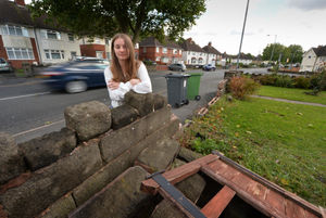 Standing next to a wall after a vehicle crashed into it,  resident Georgia Swinnerton, at Dangerfield Lane.