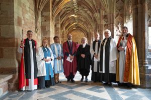 The new canons pose with the acting Bishop of Worcester Martin Gorick at Worcester Cathedral