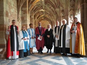 The new canons pose with the acting Bishop of Worcester Martin Gorick at Worcester Cathedral