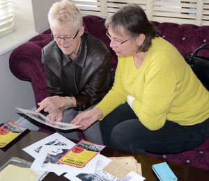 Denise, left, and Bernice look through some memorabilia.