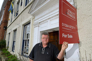 Chairman Pat Merrick outside the building in Mill Street