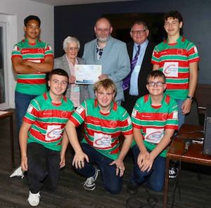Representatives of Burntwood Rugby Club receive their award