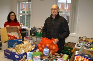 Caption: Shrewsbury Severn Rotarian John Yeomans visited the Food Bank for an update with Karen Williams.