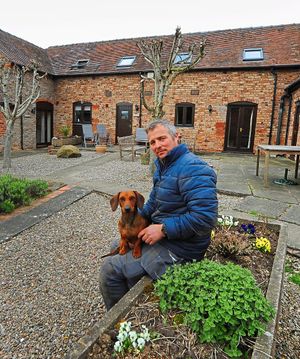 Manager Philip Brick, with 'Sprout' the dog, at Hurst Farm Cottages, Aldenham, Bridgnorth.
