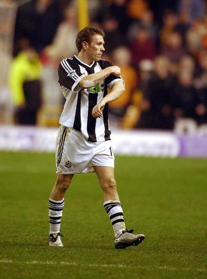 Craig Bellamy infuriated fans by pointing to the Premier League badge on his shirt at full time. Wolves were promoted five months later.
