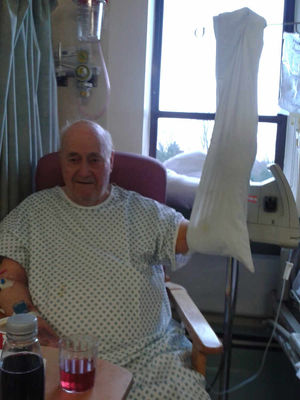 Joseph Ward with his arm in a pillow case rather than a sling