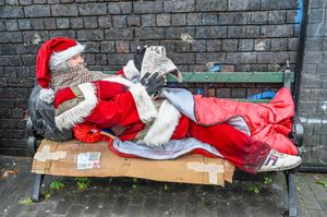 Father Christmas has showed up on a bench in Birmingham's Jewellery Quarter next to the Banksy mural. December 17 2025.