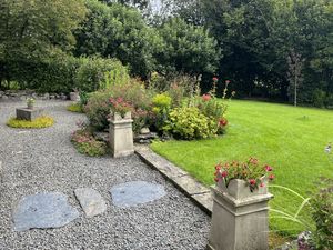 Gwernfyda, Cefn Coch, Welshpool is a 16th century house with 3/4 acre country cottage garden is surrounded by fields with pretty views. 