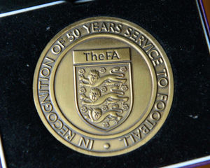 John's medal for over fifty years of service to football