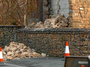 Supporting image for story: House wall fall closes busy main road