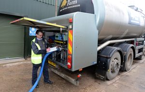 Chris Bradbury looks on as the milk is pumped into the huge silos at Belton Farm