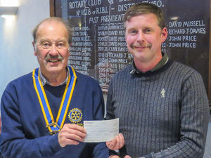 Left to right Builth Wells Rotary President, Robert Evans, presents Parkrun organiser, Lee Jarvis with a cheque.