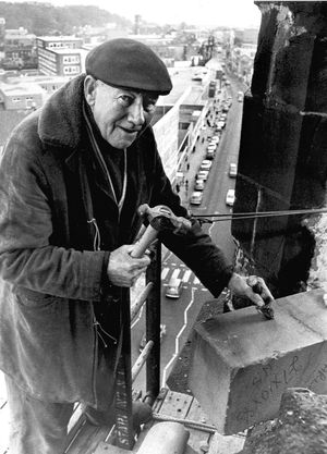 Les Dunn (68) is doing a job that would terrify most of us. Steeplejack Les, who was  repairing the stonework on St Thomas Church, Dudley, Worcs in 1975  was working 175 ft above the main street.