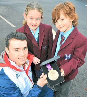 Kristian Thomas with pupils Dora Prytherch and Charles Halliday, both aged 7
