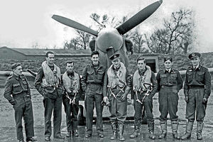 Allan Scott is third from right in this photograph with his colleagues from A Flight, 124 Squadron, in front of a Spitfire
