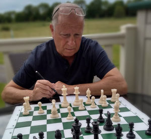 At the board.