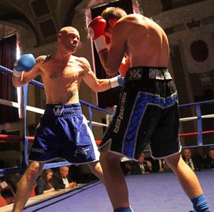 Ben Wilkes (blue shorts) on the attack in his last fight against Dan Blackwell. Picture by Robert Ellis.
