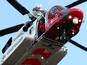 Supporting image for story: Two rescued from sinking fishing vessel by helicopter