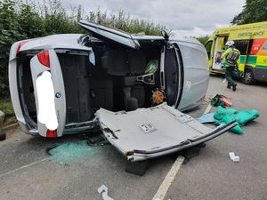 Supporting image for story: Woman cut free as BMW overturns in crash near Himley Hall