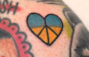 One Shot Charlies were giving heart-shaped peace symbol tattoos in the Ukrainian colours to raise money for the Red Cross.