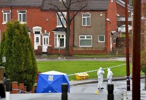 A blue police tent in Wilson Road, which is parallel to Pensnett Road where the cannabis farm was raided